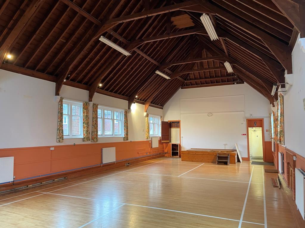 Lot: 134 - FORMER VILLAGE HALL WITH CONSENT FOR CONVERSION INTO SIX RESIDENTIAL DWELLINGS - View of vaulted hall 1